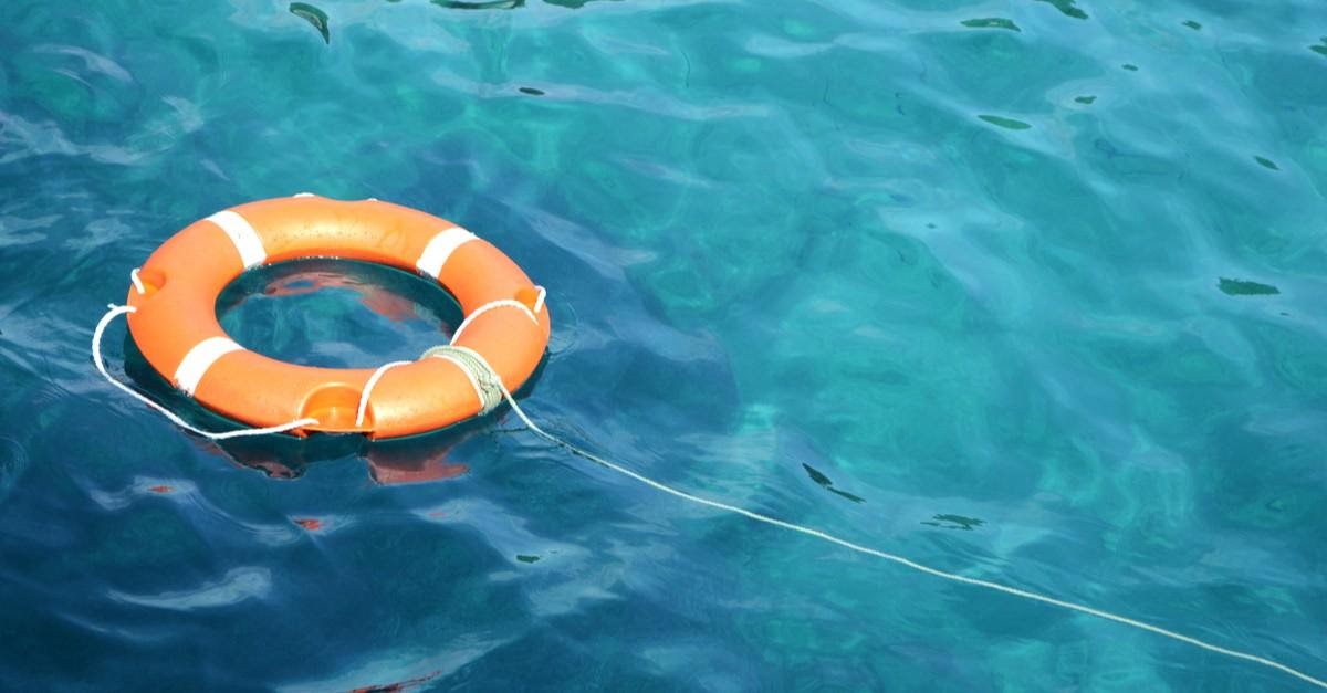 floating life ring on a string in the ocean