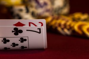 set of two cards, a two and a seven, turned up on a poker table