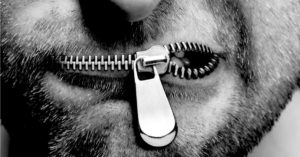 man's mouth with a zipper for the lips