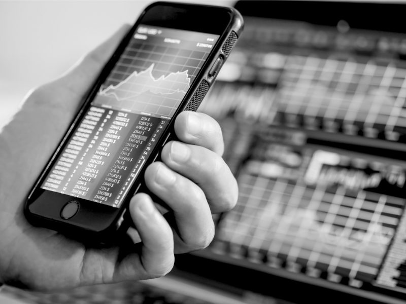 Smartphone showing hypothetical financials