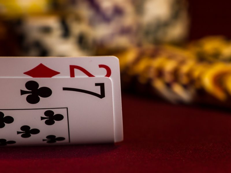 set of two cards, a two and a seven, turned up on a poker table
