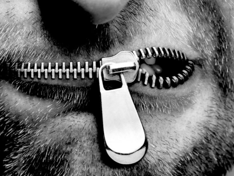 man's mouth with a zipper for the lips